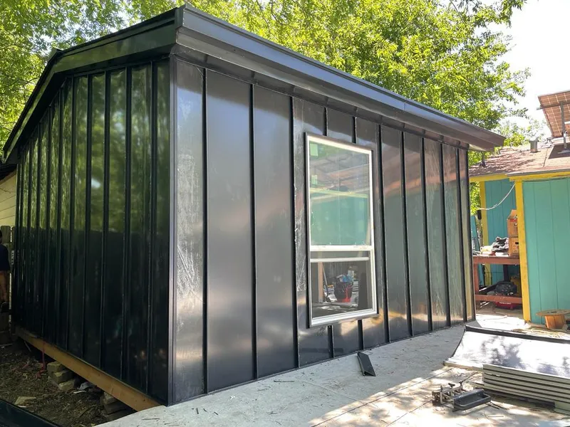 Black standing seam metal wall panels for Roof Inspection in Euless